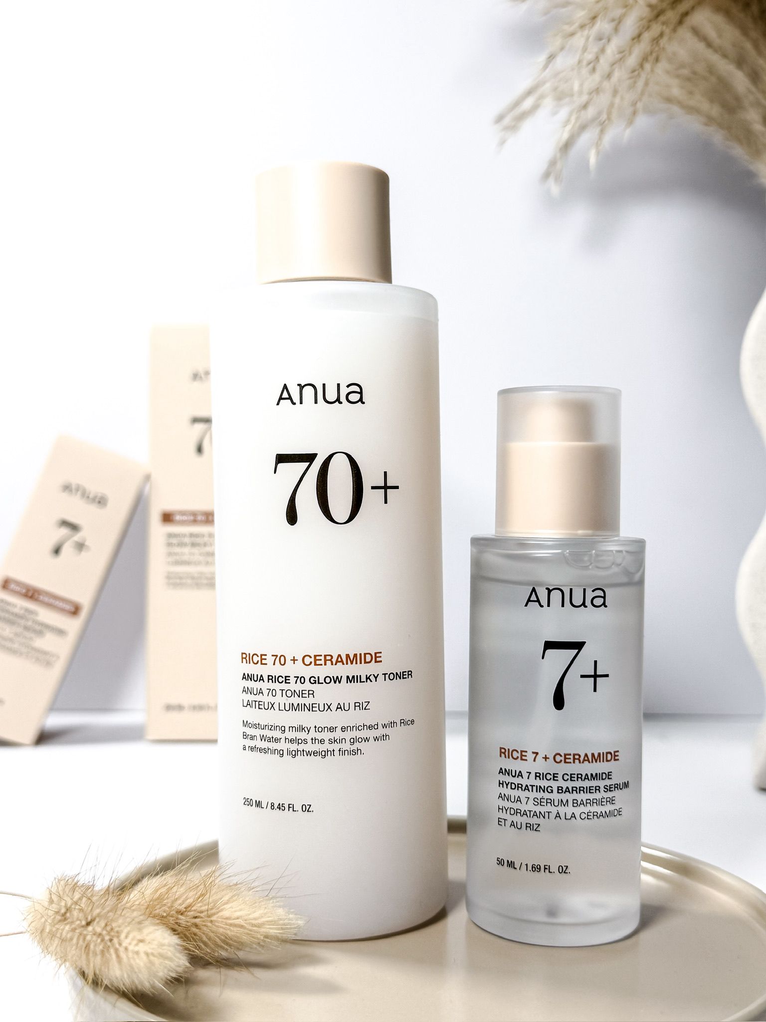 Anua Rice Ceramide 70 toner and Rice Ceramide 7 serum styled in a minimalist skincare vanity shot by Beauty With Ju