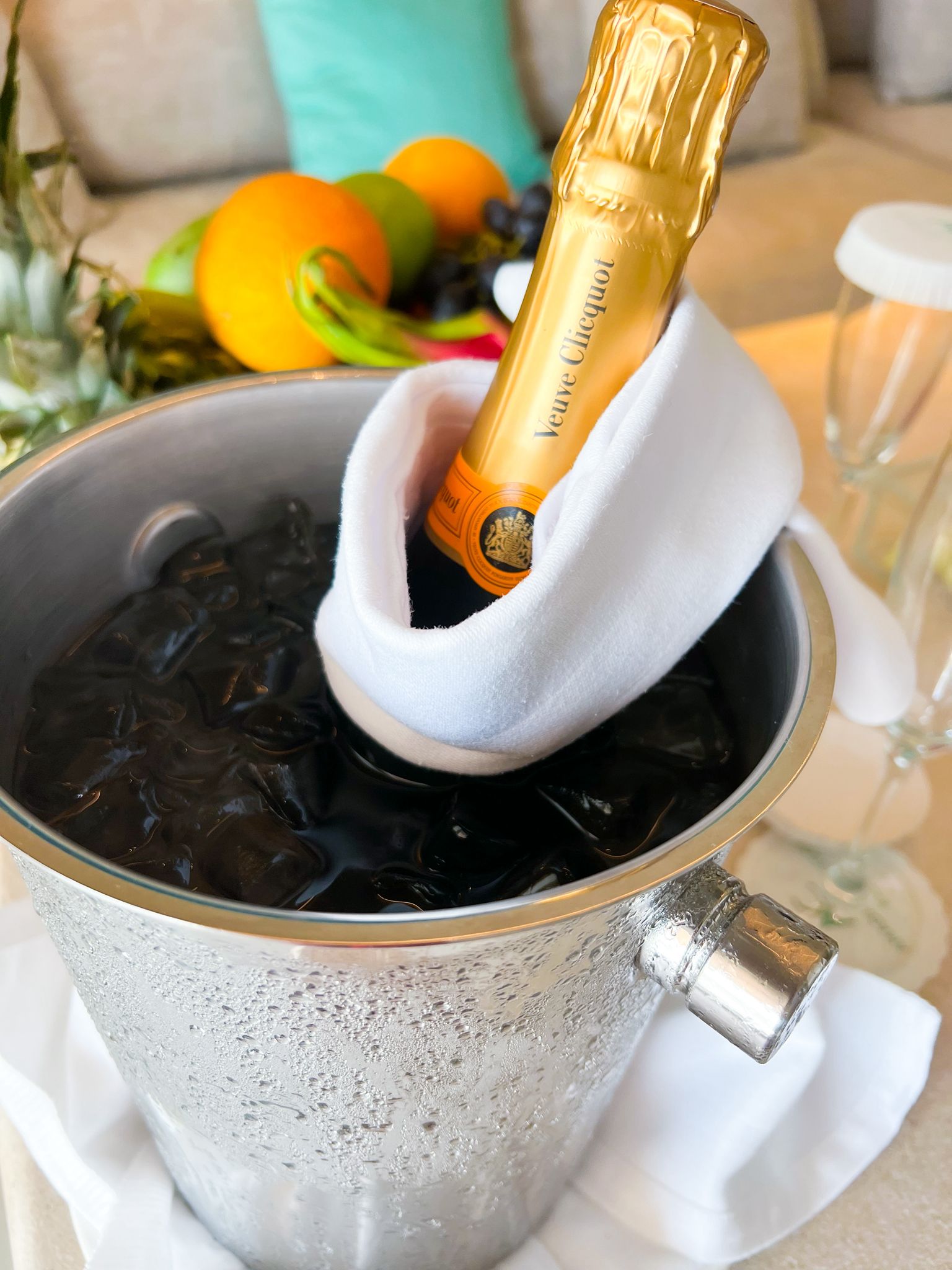 A Lifestyle shot featuring the complementary bottle of Veuve Cliquot Champagne for Villa Guests at Amada Colossos Resort.