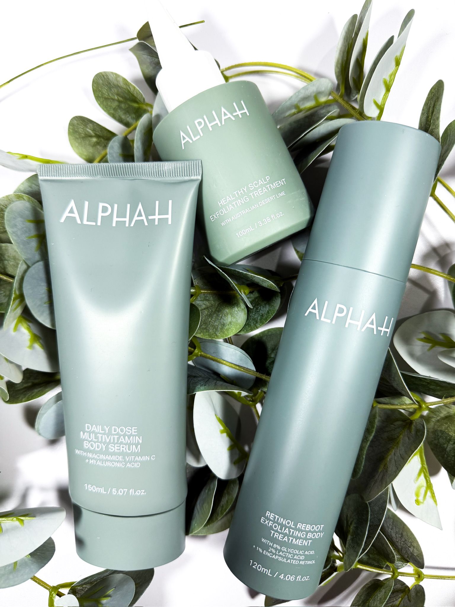 Alpha-H Body Serum, Retinol Reboot & scalp treatment styled with eucalyptus for an editorial brand feature by Beauty With Ju